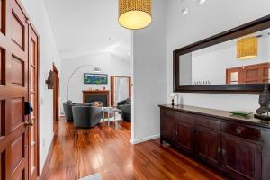 a living room with a large flat screen tv at 3984 Life of Riley home in Del Monte Forest