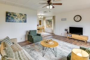 a living room with a couch and a table at Mtn-View Coulter Escape w/ Rustic Tree Lookout in Coulterville