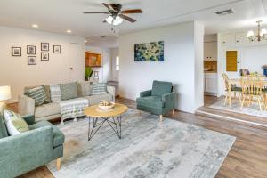 a living room with a couch and chairs and a table at Mtn-View Coulter Escape w/ Rustic Tree Lookout in Coulterville
