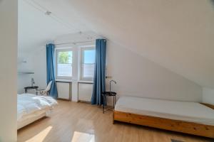 Ένα ή περισσότερα κρεβάτια σε δωμάτιο στο Seebrise - 2 Schlafzimmer - Terrasse - Bodensee