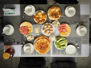 a table filled with different types of food at Nomad House in Yur'yevka