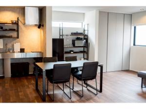 a dining room with a table and chairs at Kamogawa Sea Sauna Villa - Vacation STAY 45731v in Kawaguchi