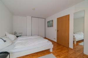 Ένα ή περισσότερα κρεβάτια σε δωμάτιο στο Seebrise - 2 Schlafzimmer - Terrasse - Bodensee +41 φωτογραφίες