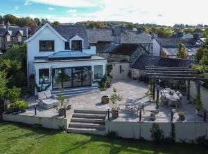 an aerial view of a house with a patio at Trelawney in Yelverton