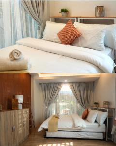 two beds in a room with a window at Villa Valber in Aga +13 photos