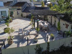 an overhead view of a patio with a table and chairs at Trelawney in Yelverton