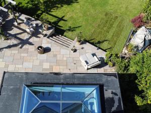 an overhead view of a backyard with a patio and a lawn at Trelawney in Yelverton +29 photos