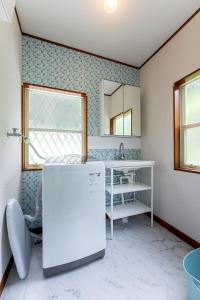 Un pat sau paturi într-o cameră la izu high village - Vacation STAY 32849v