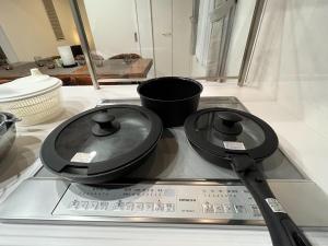 a pair of frying pans and a pair of scissors at Ume no Yu Moonlight - Vacation STAY 42183v in Dazaifu +17 photos
