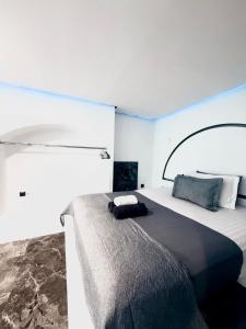 a bedroom with a large bed in a room at Cycladic Suite in Thessaloniki +9 photos
