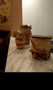 three vases sitting on top of a marble table at Appt EL3EZ in Sicca Veneria