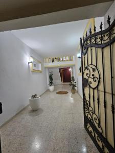 a hallway with a wrought iron gate in a house at Appt EL3EZ in Sicca Veneria