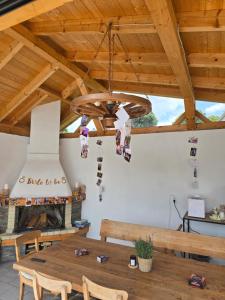 a dining room with a wooden table and a chandelier at Lauterhofen Haus 8 in Lauterhofen
