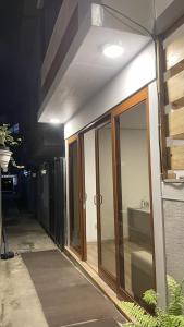 a building with sliding glass doors and a sink at Hotel 888 in Oxapampa +7 photos