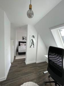 En eller flere senge i et værelse på Charming & Modern City Apartment