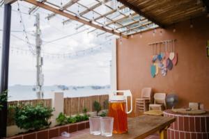 a pitcher of beer sitting on a table in a patio at Sunrise Room in Ngân Hà