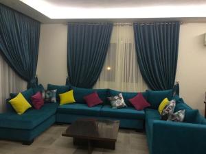 Posezení v ubytování The dream villa for an happy family vacation at Hacienda Bay Sahel