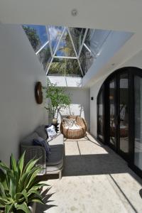 a living room with a couch and a table at ridgevillabali in Kerobokan