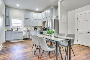 a kitchen and dining room with a table and chairs at College Hub 1 Mi to Dtwn Greensboro Group Escape in Nocho Park