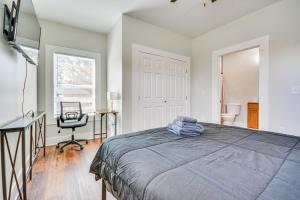 a bedroom with a bed and a desk and a chair at College Hub 1 Mi to Dtwn Greensboro Group Escape in Nocho Park