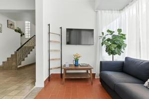 a living room with a couch and a table at Pr Rentals Walk To La Placita & Condado Beach in San Juan