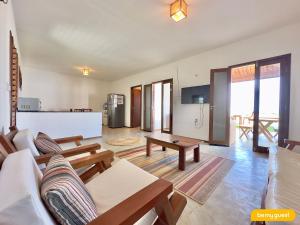 a living room with a couch and a table at Reserva BeachFront - Retirinho in Aracati