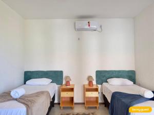 a room with two twin beds and a heater at Reserva BeachFront - Retirinho in Aracati +71 photos