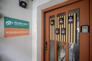 a door with a sign that reads subscriber interest agreement at Ruhiges Studio in Altstadt mit Gartenblick & Sofa in Freiberg +7 photos