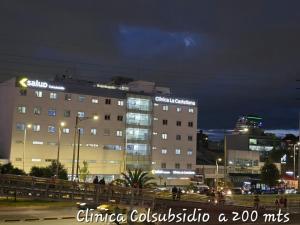 a building with lights on in a city at night at Hotel Castellana 95 Bogota By Hoteles Confort 80 in Bogotá