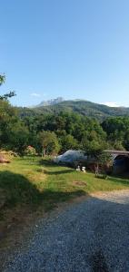 a group of tents in a field next to a road at Le Notti Magiche in Occhieppo Superiore