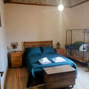 Postel nebo postele na pokoji v ubytování Casa sol nascente hospedagem bichinho MG