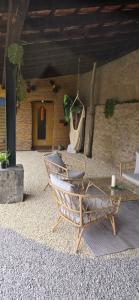 a patio with a chair and a table and a building at FeWo Oahu in Meisenheim