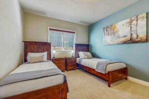 a bedroom with two beds and a window at Bondgard Hideaway in Enumclaw