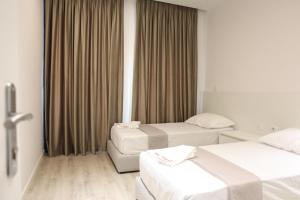 Ένα ή περισσότερα κρεβάτια σε δωμάτιο στο Meli Deluxe Apartments +77 φωτογραφίες