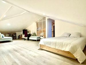 a bedroom with a bed and a living room at La Petite Cabine, 3chambres proche plage et centre in Les Sables-dʼOlonne