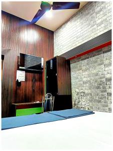 a room with a table and a chair in a building at Hotel P-V-R 50 Meters Only From Railway Station With Free Internet Services in Bhubaneshwar