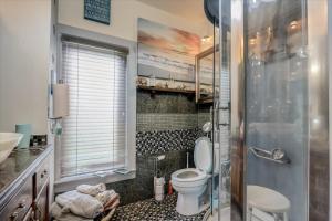 a bathroom with a toilet and a sink at Relax & Reboot  +14 photos