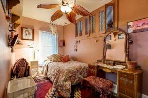 a bedroom with a bed and a dresser and a mirror at Relax & Reboot 