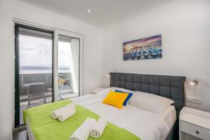 a bedroom with a large bed with towels on it at Villa Eva in Dramalj +26 photos