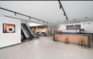 TV a/nebo společenská místnost v ubytování فنادق الوحدة محبس الجن