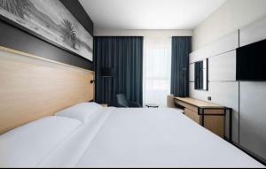 Postel nebo postele na pokoji v ubytování فنادق الوحدة محبس الجن + 15 fotografií