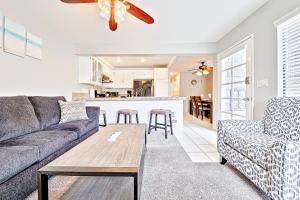 a living room with a couch and a table at Perfect Newport Beach Location With Spa I in Newport Beach +17 photos