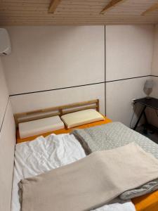 a small room with a bed and a table at Modern holiday home in Teplička nad Váhom +1 photo