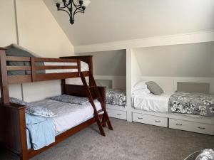 two bunk beds in a room with two beds at Tamarack Retreat Donnelly ID in McCall