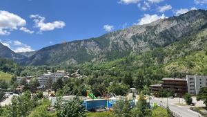 a view of a city with mountains in the background at Appartamento panoramico in montagna Alpi Bardonecchia in Bardonecchia