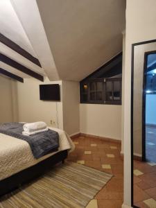 Postel nebo postele na pokoji v ubytování Nido del Altillo + 10 fotografií