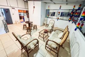 a room with chairs and tables in a room at Los Chullos in Cusco