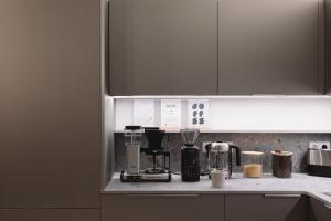a kitchen with a counter top with a coffee maker at Outsite Barcelona in Barcelona