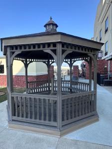 a gazebo with a roof on a sidewalk at Holiday Inn Express & Suites Sealy by IHG in Sealy