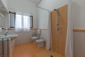 a bathroom with a toilet and a shower and a sink at Selene BeB in Casalbordino +25 photos